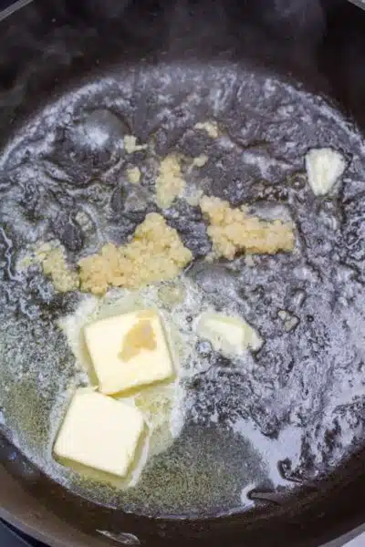 Process image 1 showing butter and oil in pan sauteing garlic.