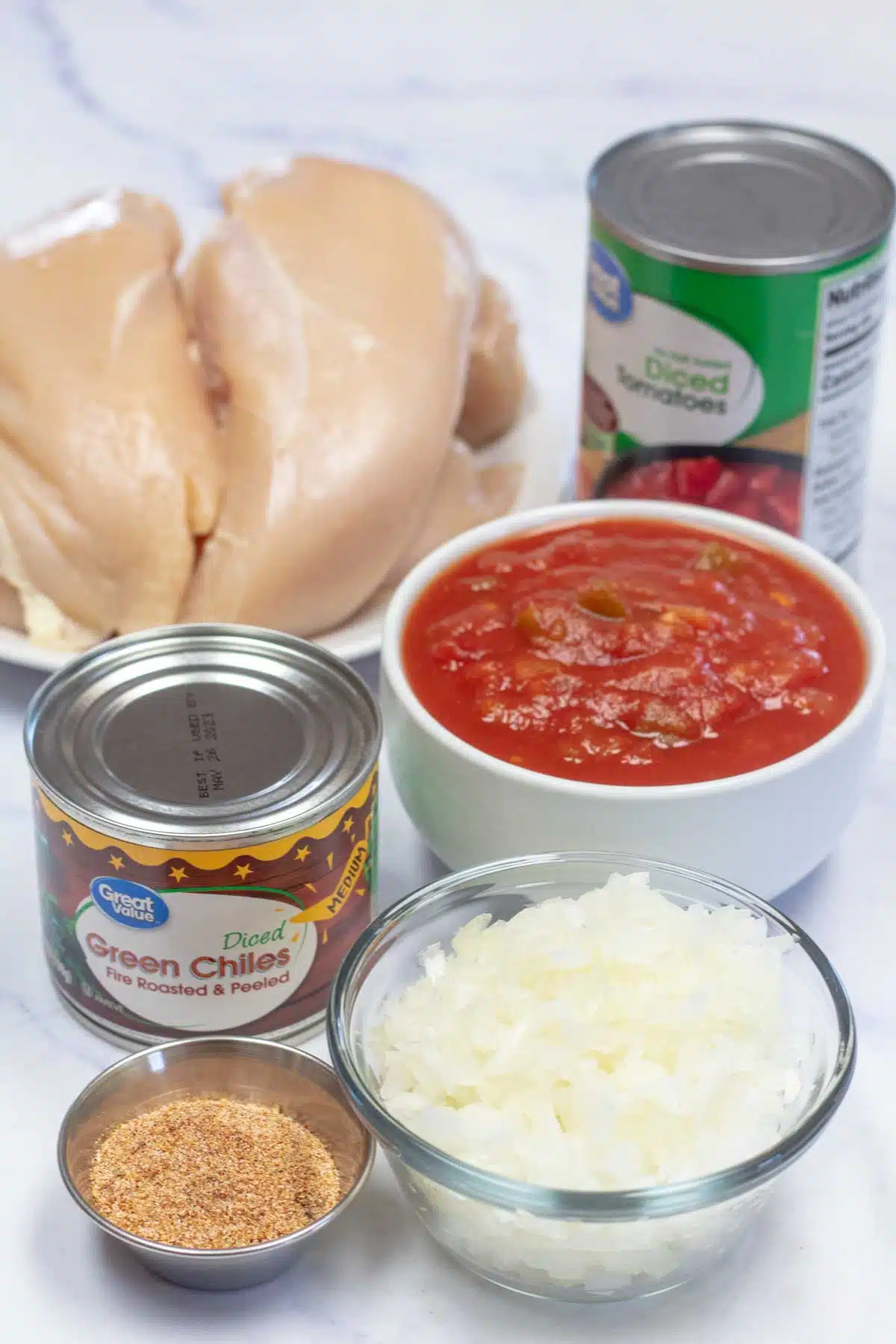 Tall image showing ingredients needed for crockpot chicken tacos.