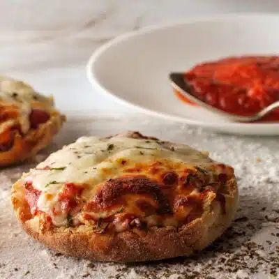 Squaree image of English muffin pizzas.