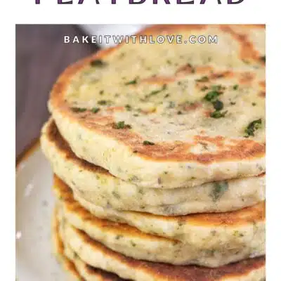Pin image with text showing homemade flatbread stacked on a plate.