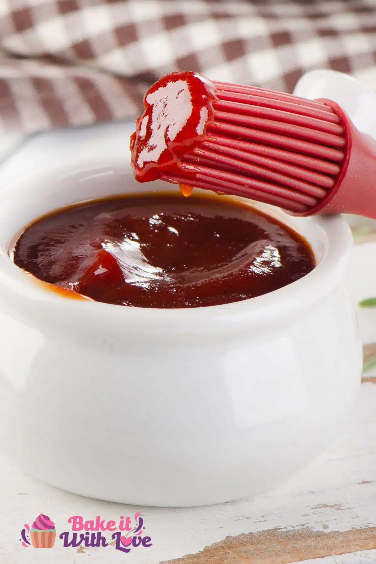 Tall image of honey bbq sauce in a small white bowl.