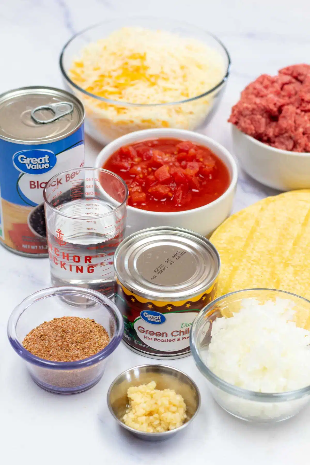 Tall image showing Mexican lasagna casserole ingredients