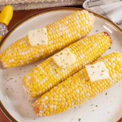Square image of microwaved corn on the cob.