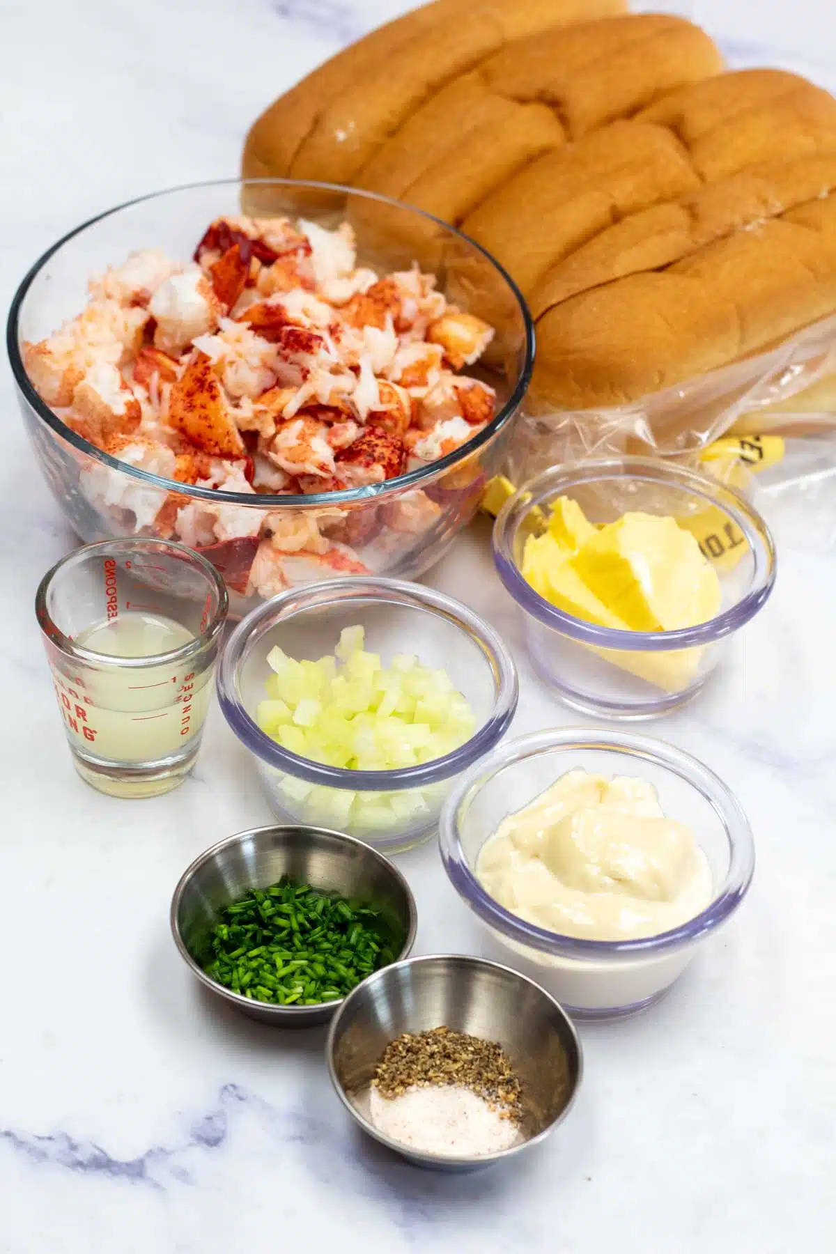 Tall image showing lobster roll ingredients.