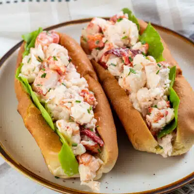 Square image of New England lobster roll.