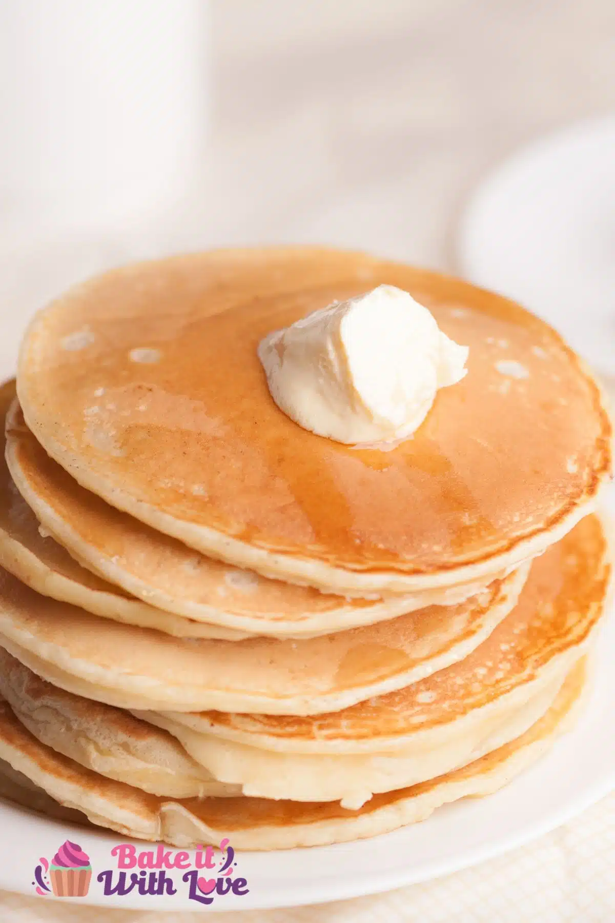 Tall image of a stack of pancakes made without eggs.