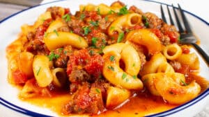 Wide image of a plate of slow cooker goulash.