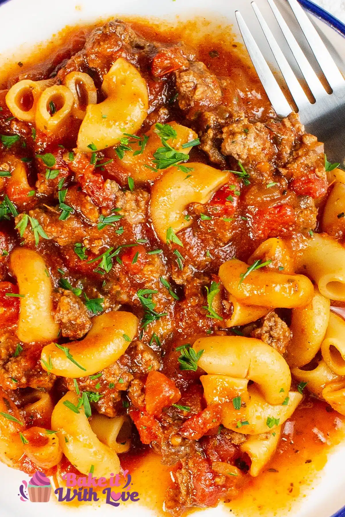 Tall image of a plate of slow cooker goulash.