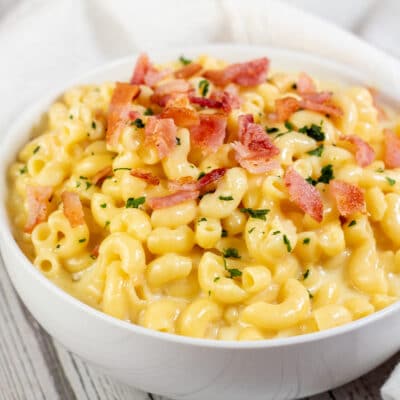Square image of smoked Gouda mac and cheese in a white bowl.