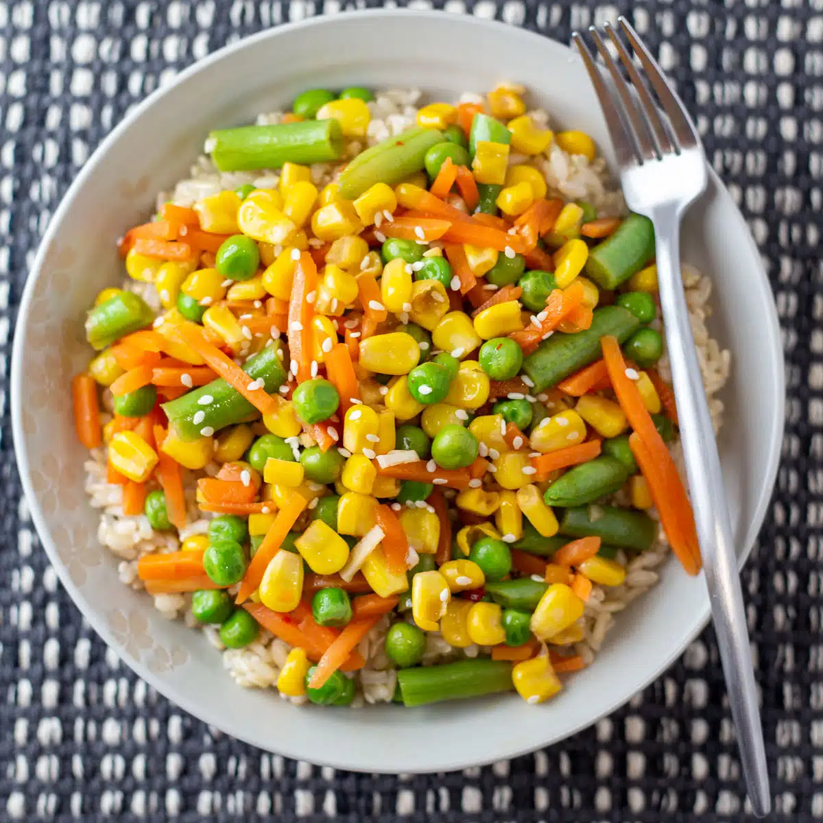 Square image of frozen veggie stir fry on a plate.