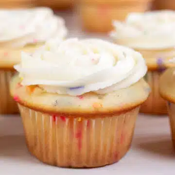 Wide image showing birthday cake funfetti cupcakes.