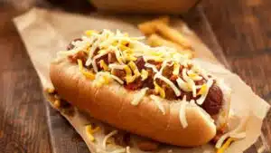 Wide image of chili dogs.