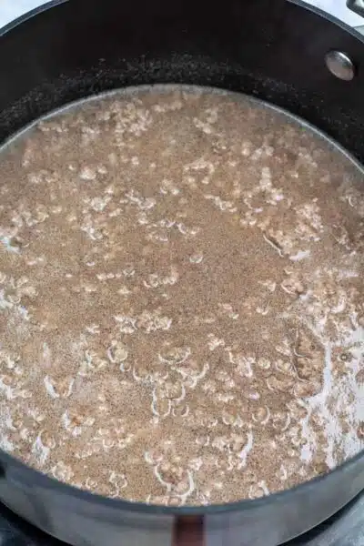 Process image 2 showing ground beef after boiling in water.