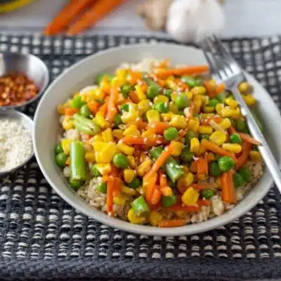 Tall image of frozen veggie stir fry on a plate.