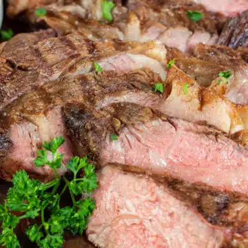 Wide image of sliced grilled chuck roast.