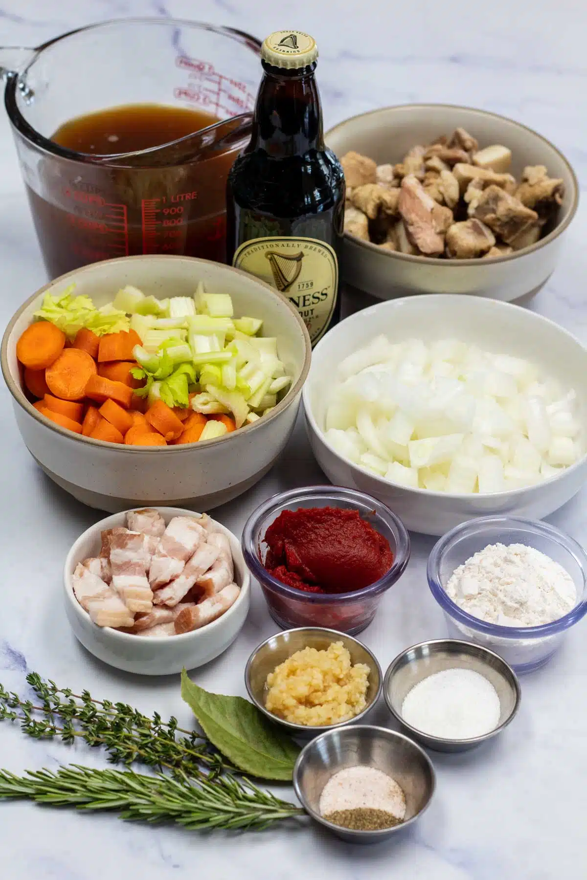 Tall image of Guinness lamb stew ingredients.