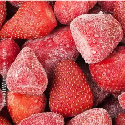 Pin image with text of frozen strawberries.