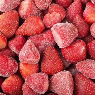 Square image of frozen strawberries.