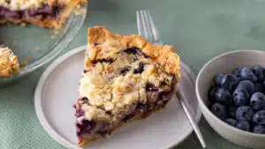 Wide image of sour cream blueberry pie.
