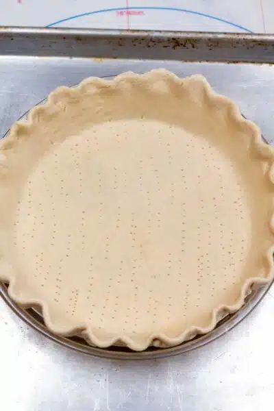 Banana cream pie process photo 1 roll out your pie crust and fill a 9 inch pie pan.