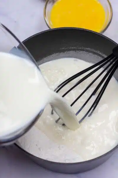 Banana cream pie process photo 4 add the whole milk and stir to dissolve sugar.