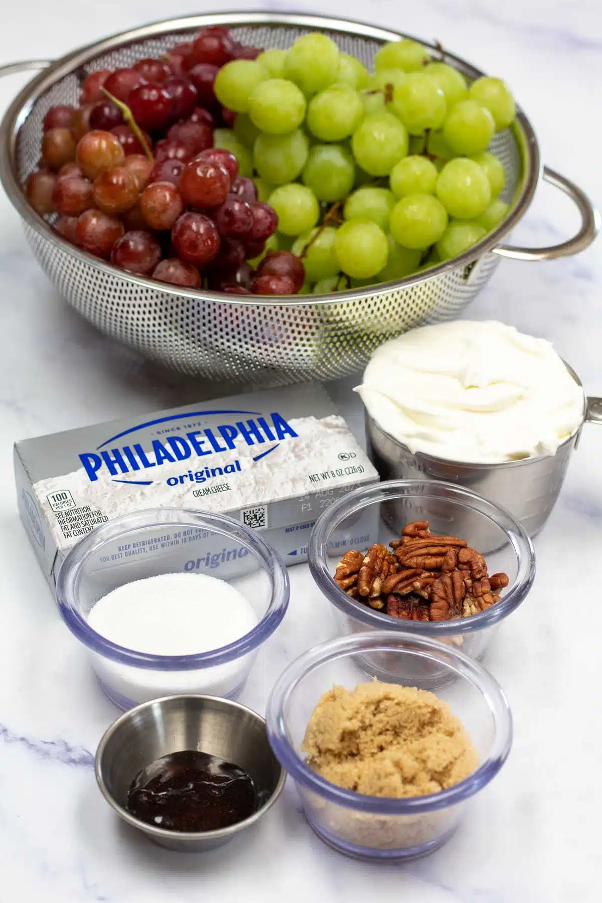 Tall image of creamy grape salad ingredients.