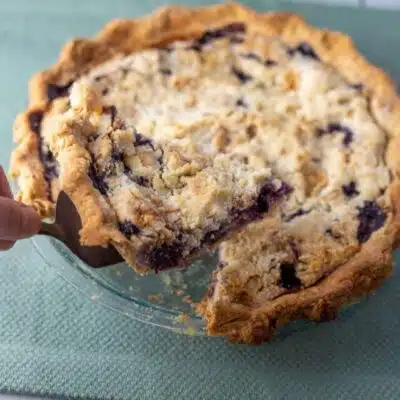 Tall image of sour cream blueberry pie.