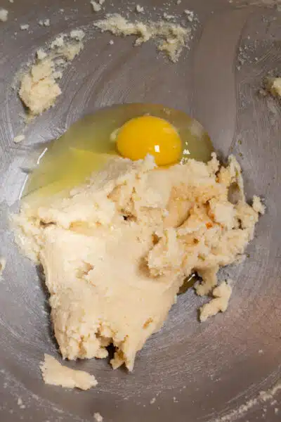 Process image 3 showing creamed butter and sugars with egg.
