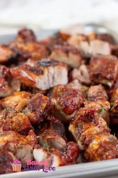 Tall image of grilled bbq pork rib tips.