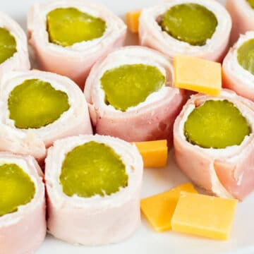 Wide image of pickle roll up appetizers.