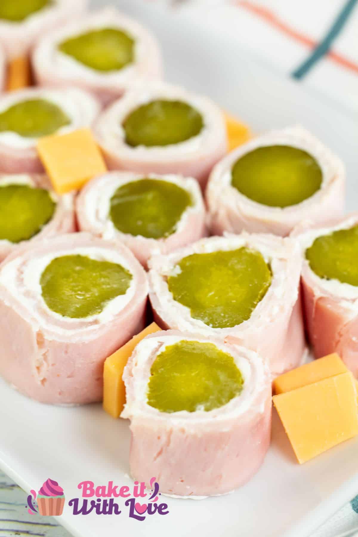 Tall image of pickle roll up appetizers.