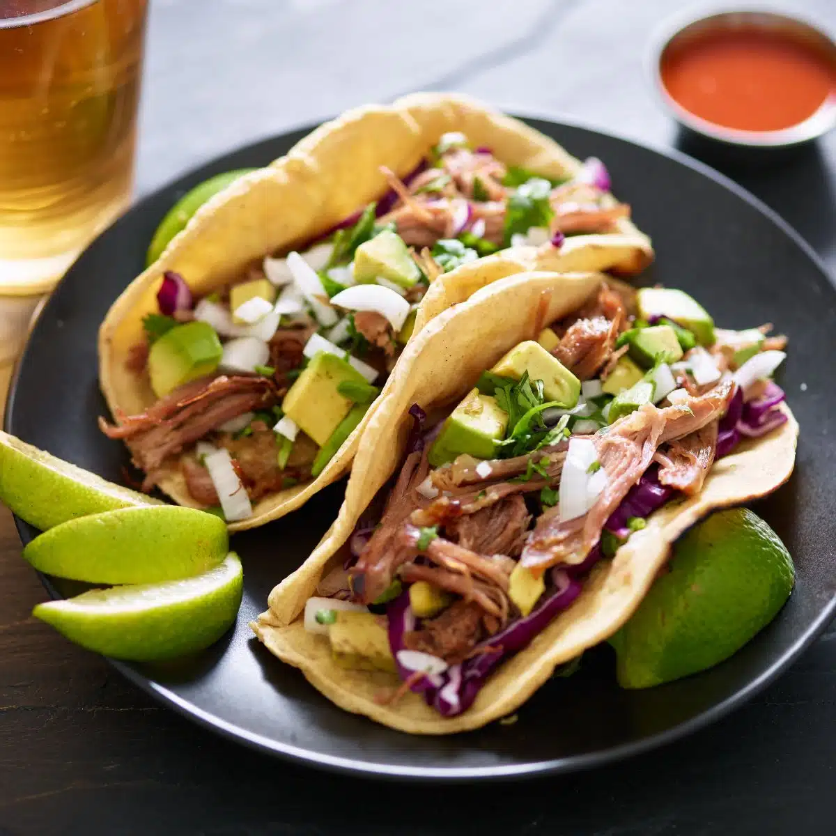 Square image of pork tacos.