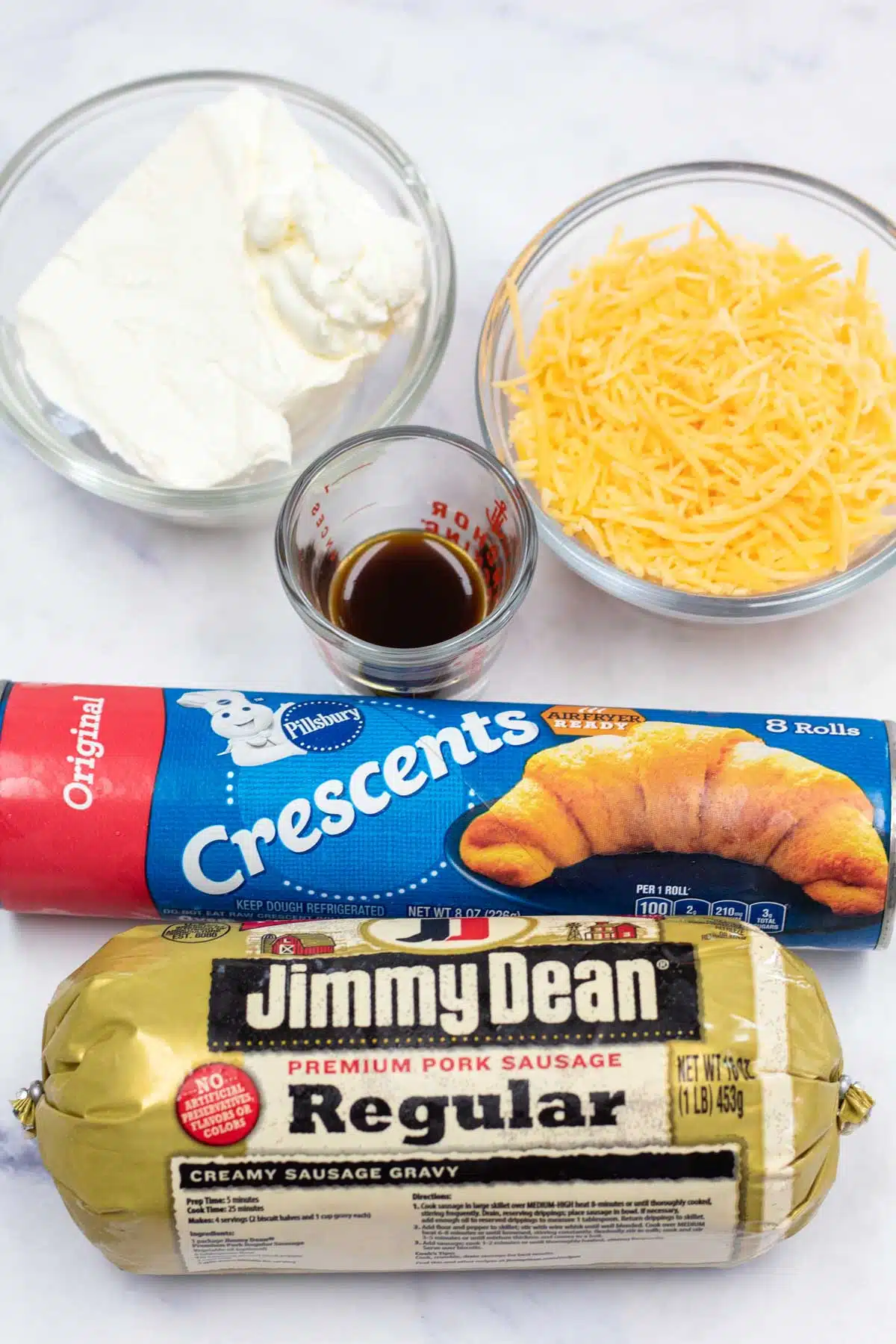 Tall image of sausage cream cheese crescent roll ingredients.
