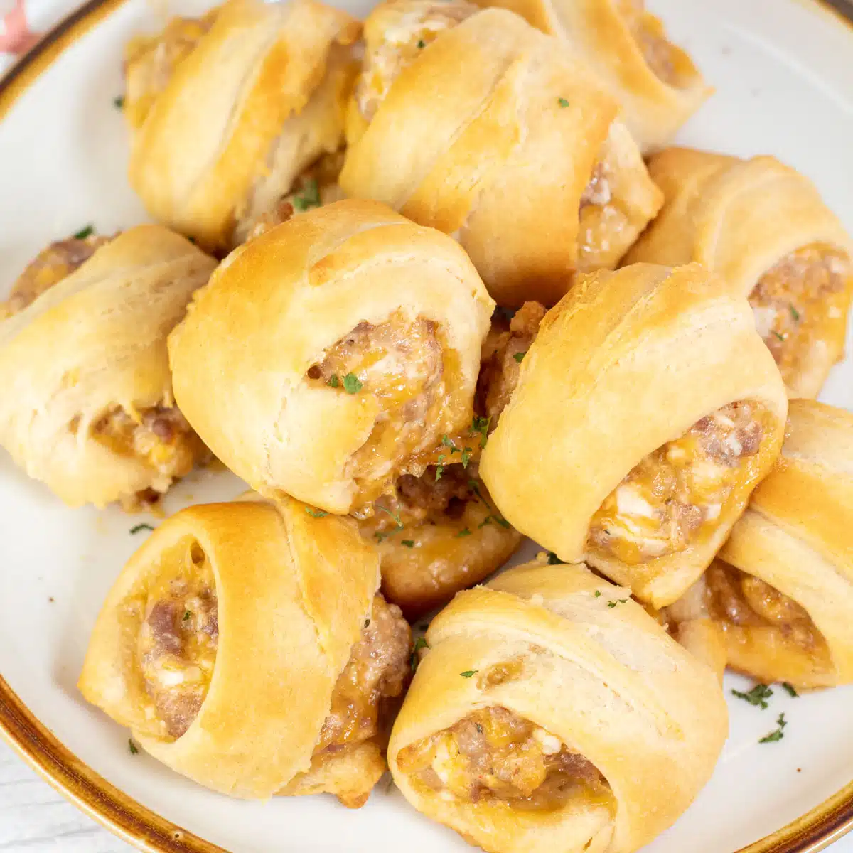 Square image of sausage cream cheese crescent rolls.