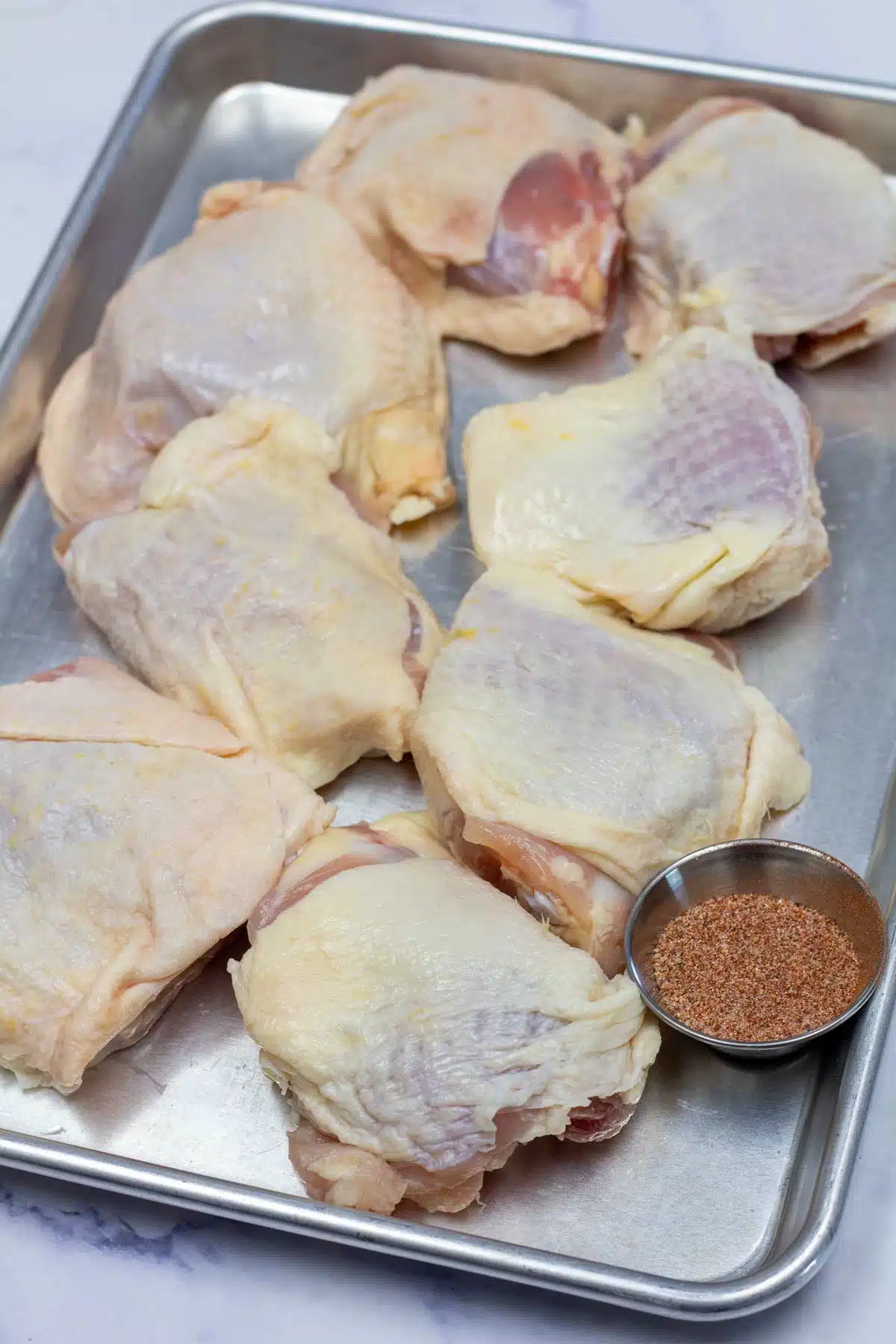 Tall image of smoked chicken thigh ingredients.
