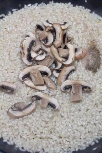 Process image 6 showing added mushrooms and seasoning.
