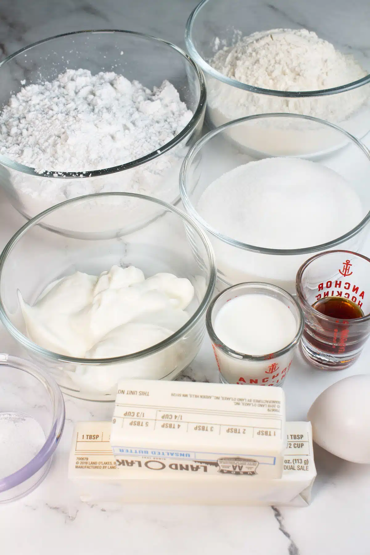 Tall image showing ingredients needed for sour cream cookies.