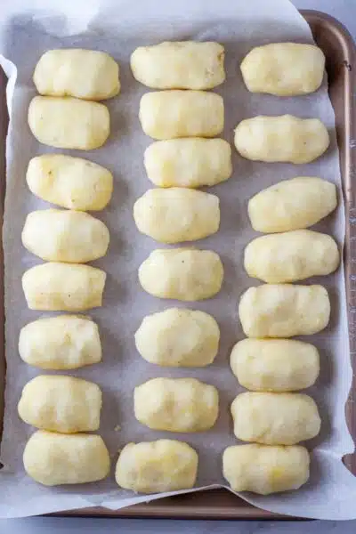 Process image 4 showing rolled cheese croquettes.