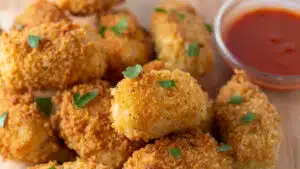 Wide image of cheese croquettes.