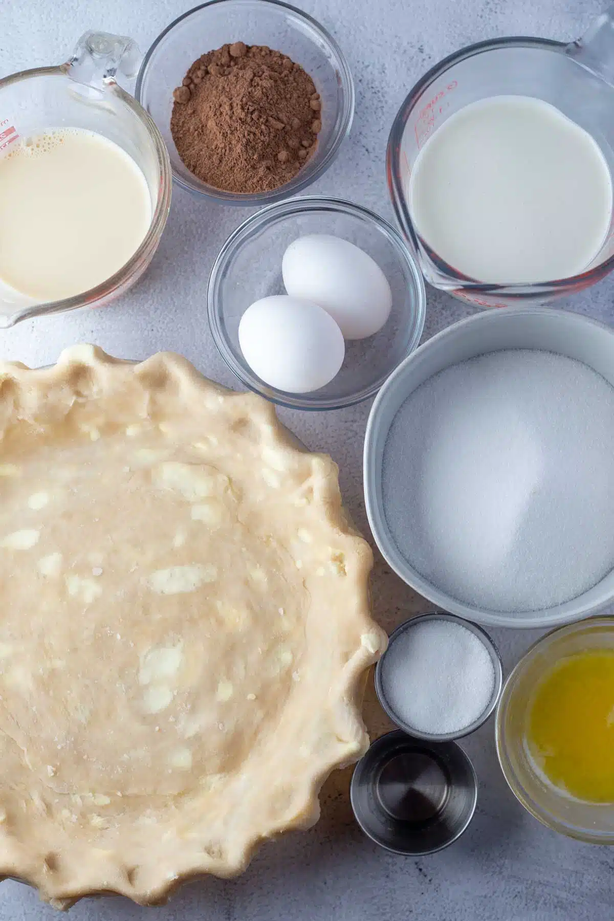 Tall image showing chocolate chess pie ingredients.