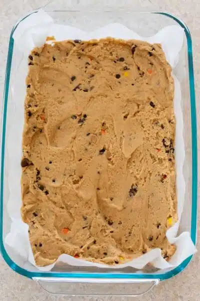 Process image 7 showing cookie dough pressed into baking dish.