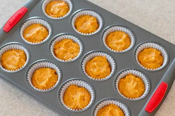 Process image 7 showing batter portioned in muffin liners.
