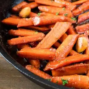 Square image of brown sugar glazed carrots.