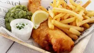Wide image showing fish and chips.