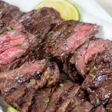 Wide image of sliced grilled skirt steak.