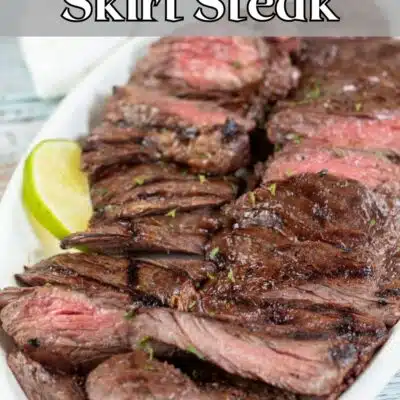 Pin image with text of sliced grilled skirt steak.
