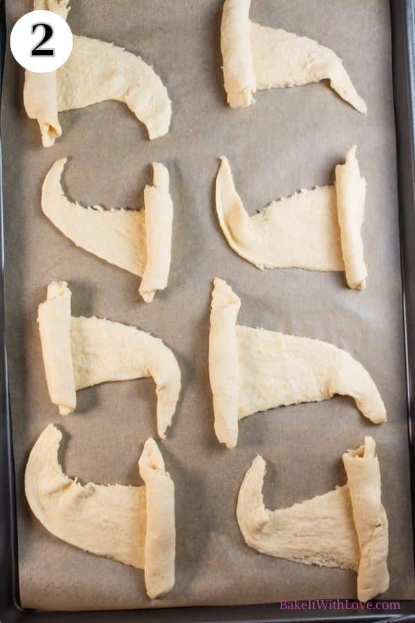 Halloween crescent roll witches hats process photo 2 showing 8 crescent rolls that have been shaped into hats.