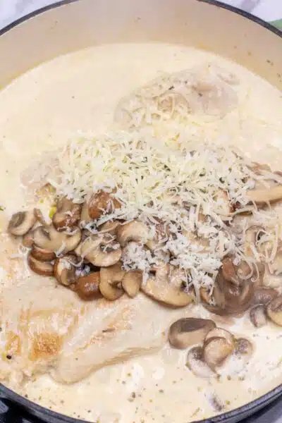 Process image 7 showing mushrooms and Parmesan added back to sauce.