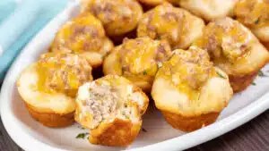 Wide image showing sausage cream cheese biscuit bites.