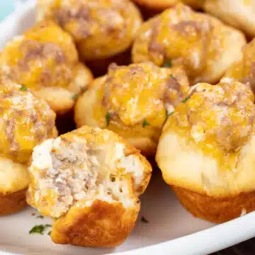 Wide image showing sausage cream cheese biscuit bites.
